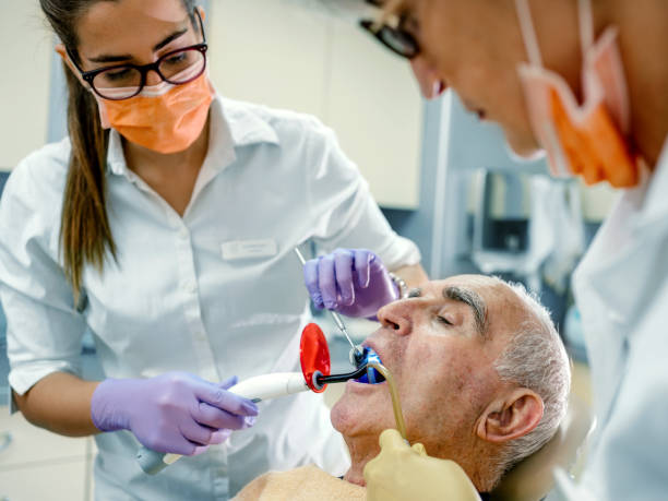 an elderly man under sedation during a dental appointment